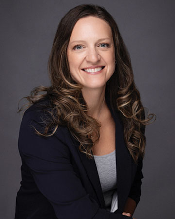 a woman with long hair smiling